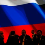 Backdropped by Russia s flag officials wait