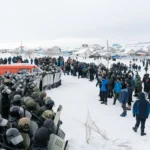 Riot policemen disperse protesters in the town of Baymak