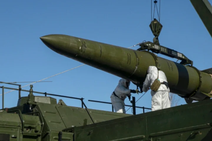 Russian troops load an Iskander missile