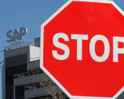 A view shows a sign with the logo of SAP software company on the roof of an office building in Moscow