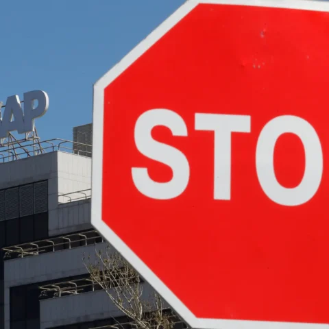 A view shows a sign with the logo of SAP software company on the roof of an office building in Moscow