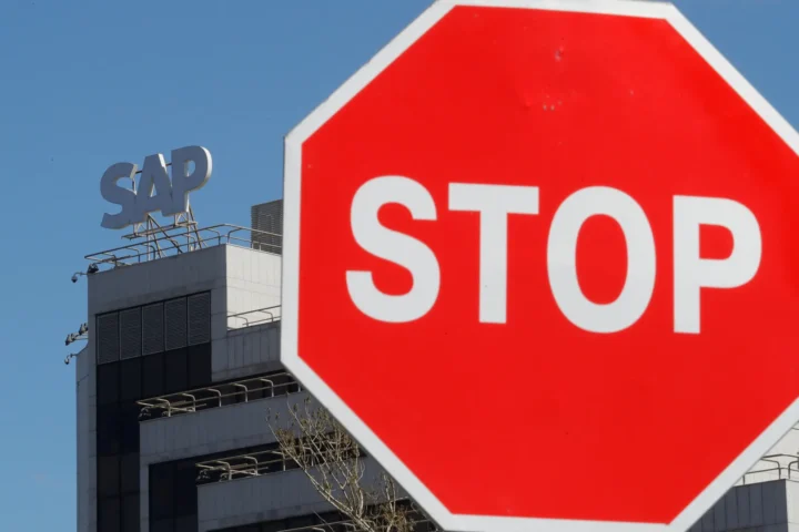 A view shows a sign with the logo of SAP software company on the roof of an office building in Moscow