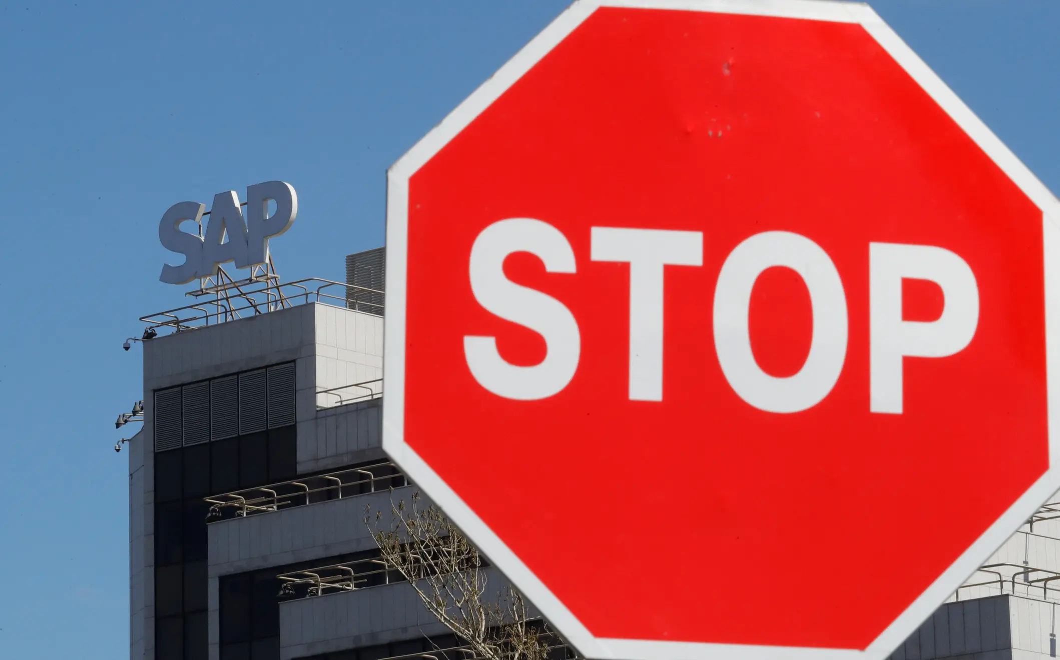 A view shows a sign with the logo of SAP software company on the roof of an office building in Moscow