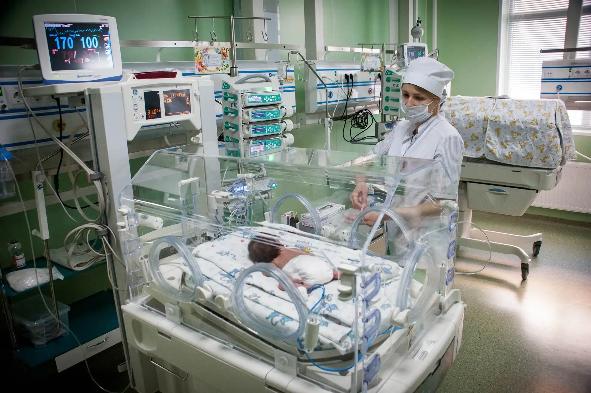 Tambov region, Russia - Doctor at the cuvette with the child