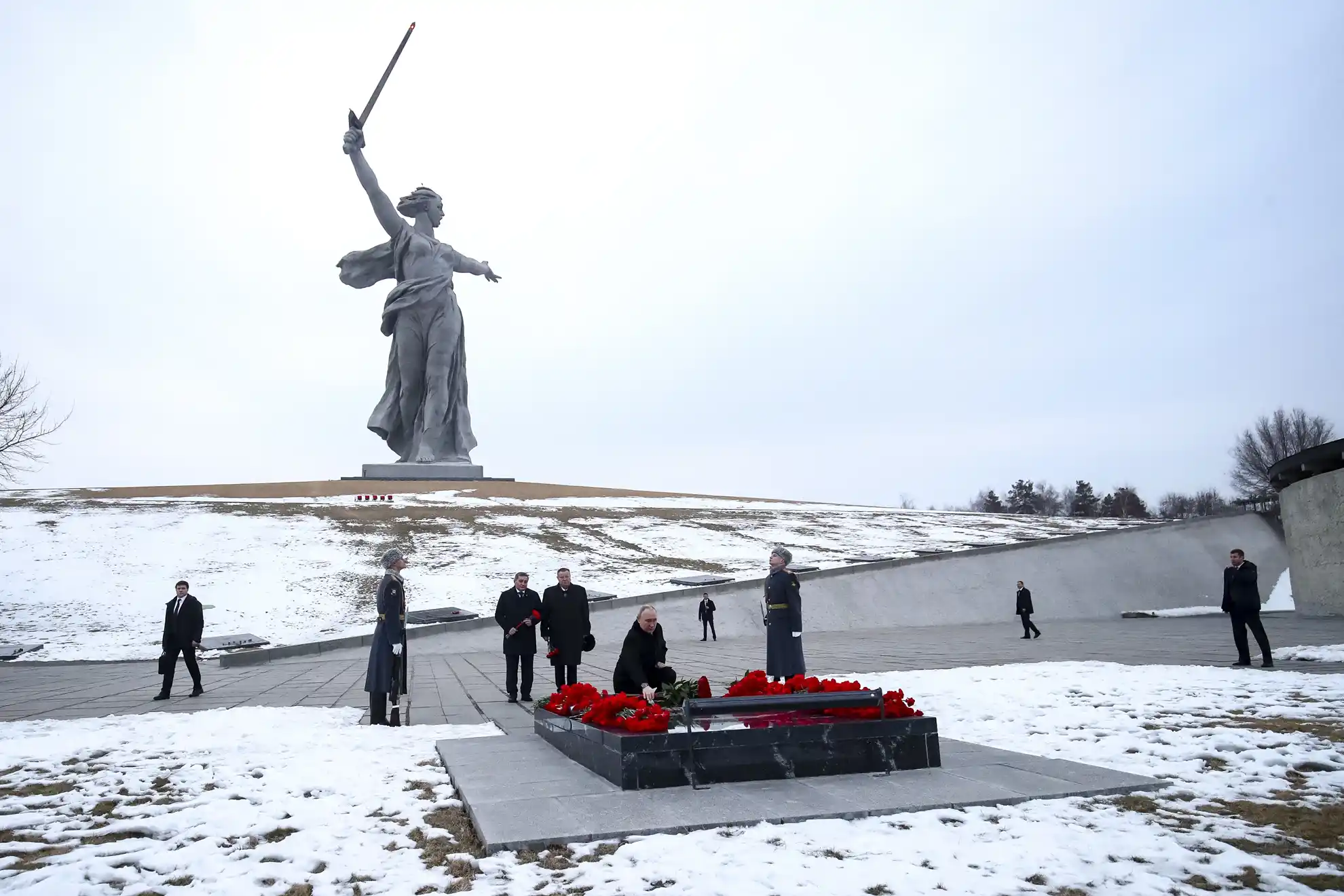 Russian President Vladimir Putin lays flowers at the memorial