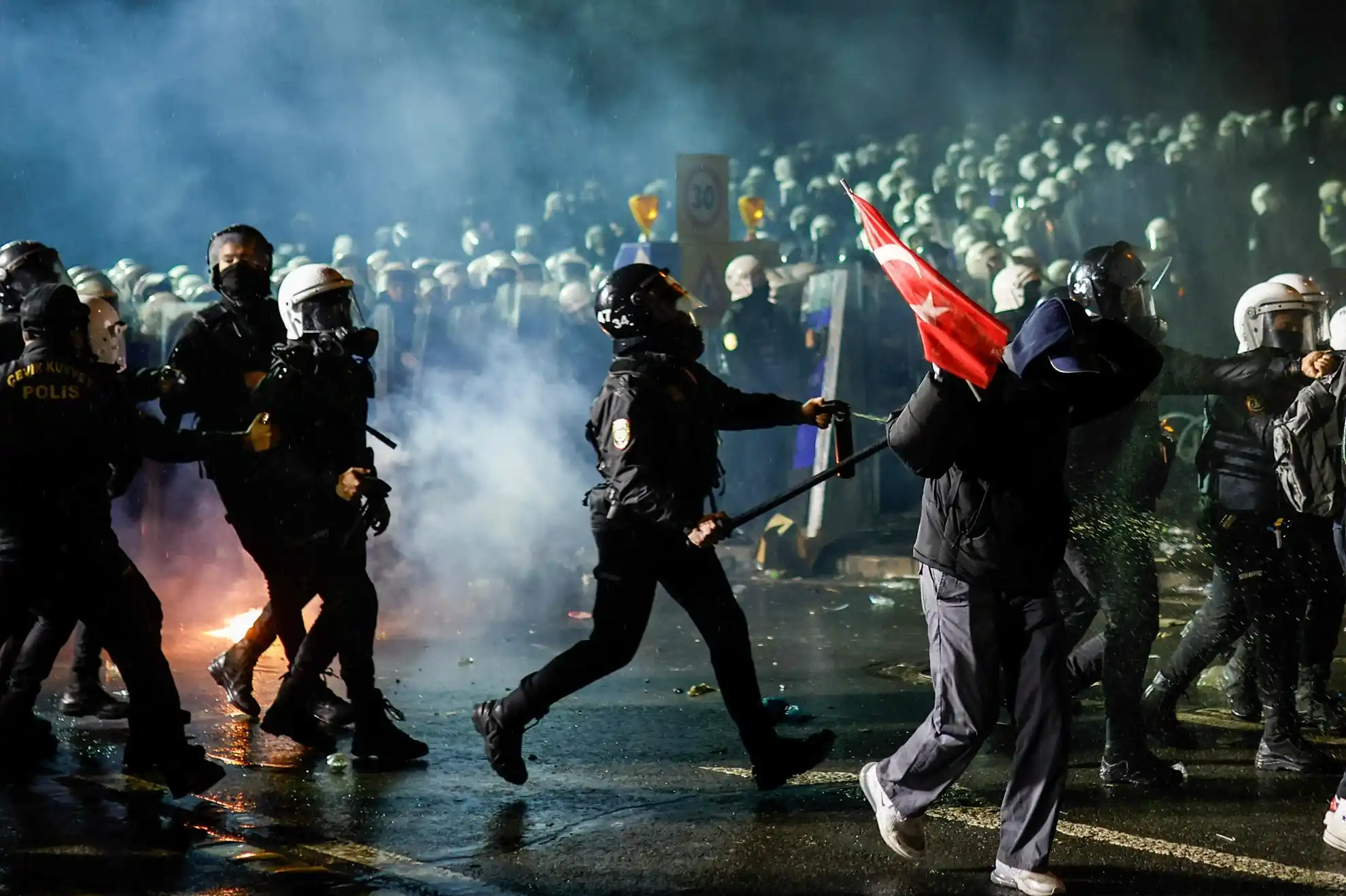 Turkish anti-riot police officers use pepper spray