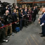 U.S. President Donald Trump talks to members of the media