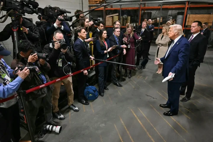 U.S. President Donald Trump talks to members of the media