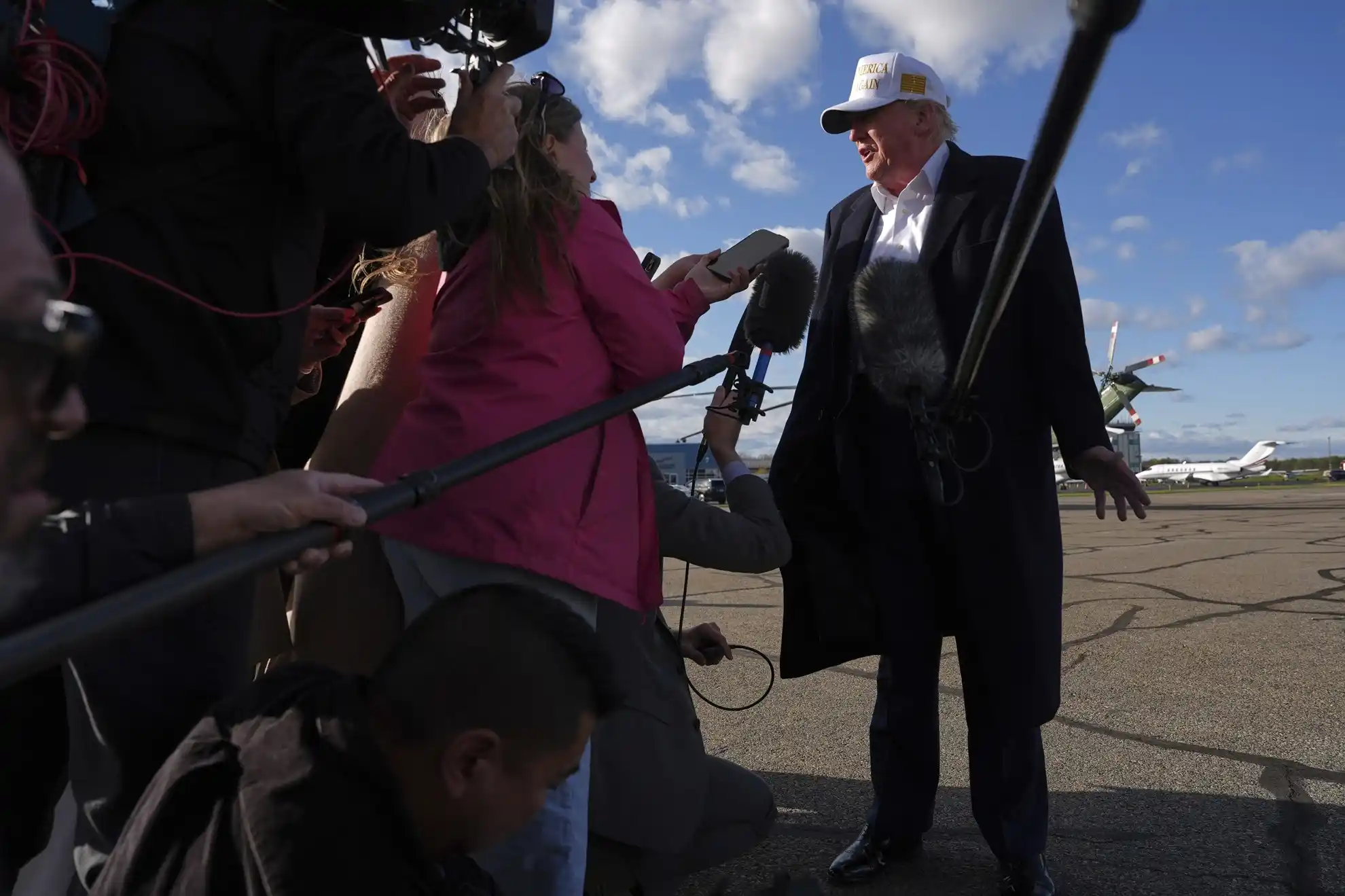 President Donald Trump speaks with reporters