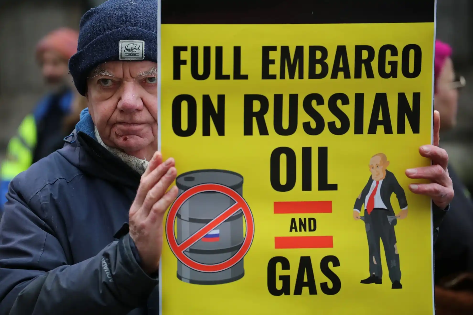 A protester holds a sign
