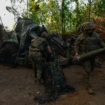 Ukrainian soldiers fire an American-made M777 Howitzer