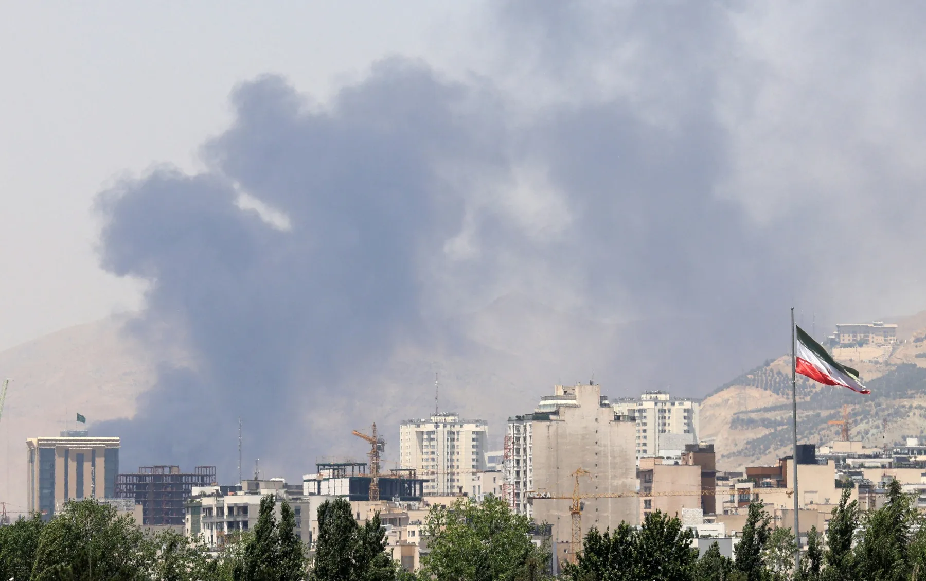 Smoke rises from the Shahran oil depot