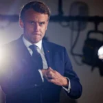 Macron is looking for something.