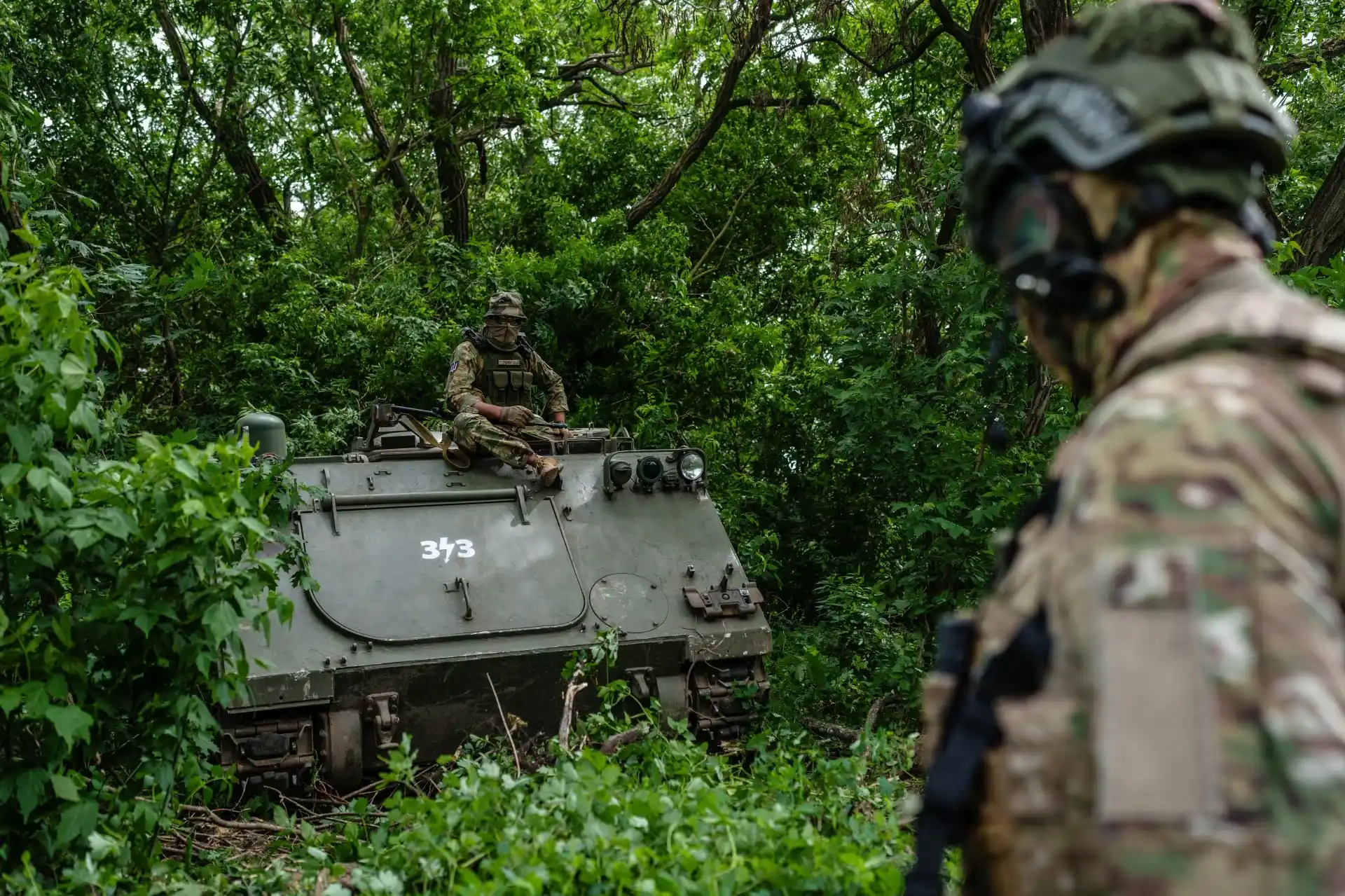 Ukrainian soldiers and armored vehicles
