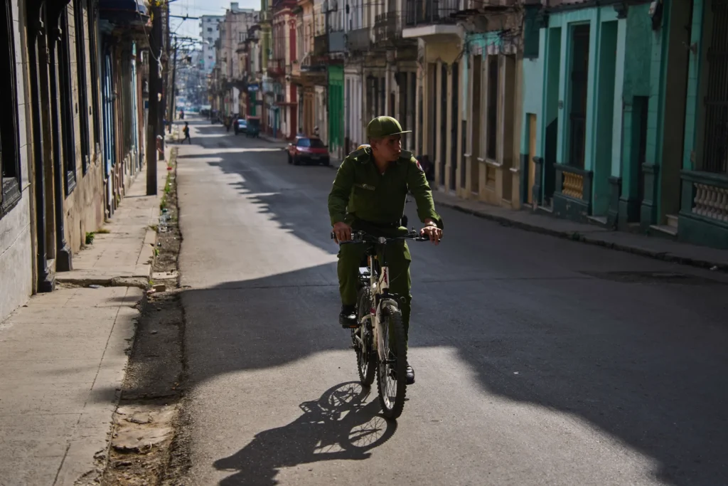 A Cuban soldier on a bicycle