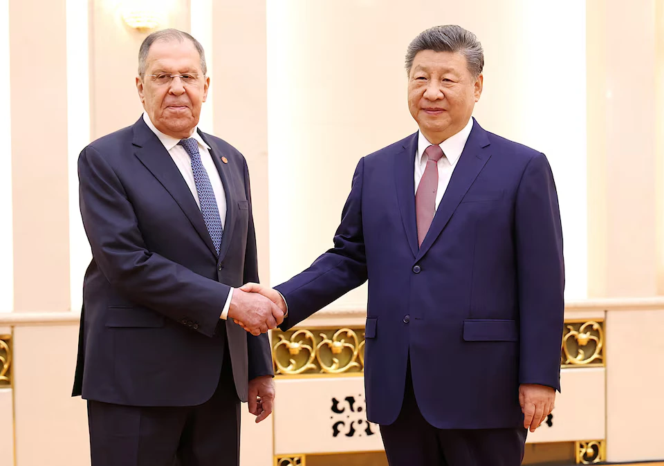 Chinese President Xi Jinping and Russias Foreign Minister Sergei Lavrov
