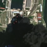 Спутниковый снимок горящих нефтяных резервуаров